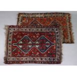 Two Hamadan rugs, each with two central lozenges on a madder ground within multiple borders; 3’ x 4’