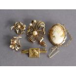 A 9ct gold open-work flower brooch set pearls, and pair of matching ear-clips (10.9g total); a 9ct