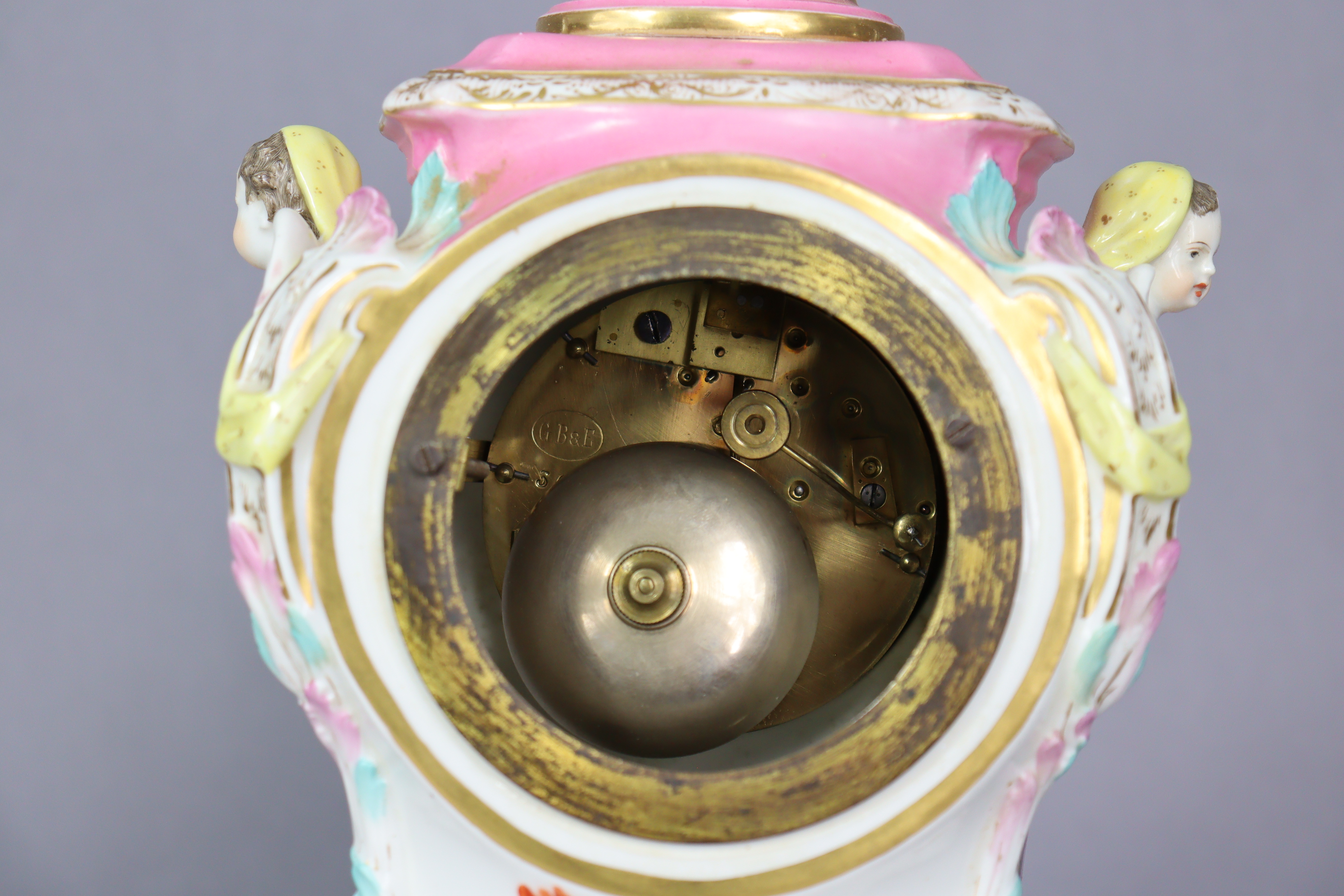 A 19th century Berlin porcelain mantel clock in pink-ground baluster form case, with urn finial & - Image 6 of 10