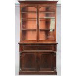 A Victorian mahogany secretaire bookcase, with moulded cornice above three adjustable shelves