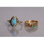 A yellow metal ring set oval black opal, size Q, 2.2g; & another set small green stone (a second