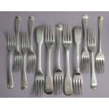 A George III silver Old English table fork; seven ditto dessert forks (George III & later); & four