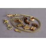 Eleven various 9ct gold pendant bracelet charms – unmounted (11.8g total); & a gilt-metal boot charm