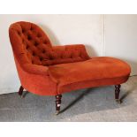 A Victorian-style small chaise longue with buttoned-back & sprung seat upholstered crimson material,