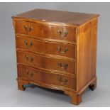 A yew-wood small serpentine-front chest fitted four long drawers with brass swing handles, & on