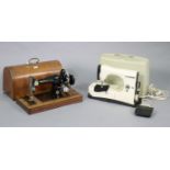 A Harris “No. 9H” hand sewing machine; & a Necchi electric sewing machine.