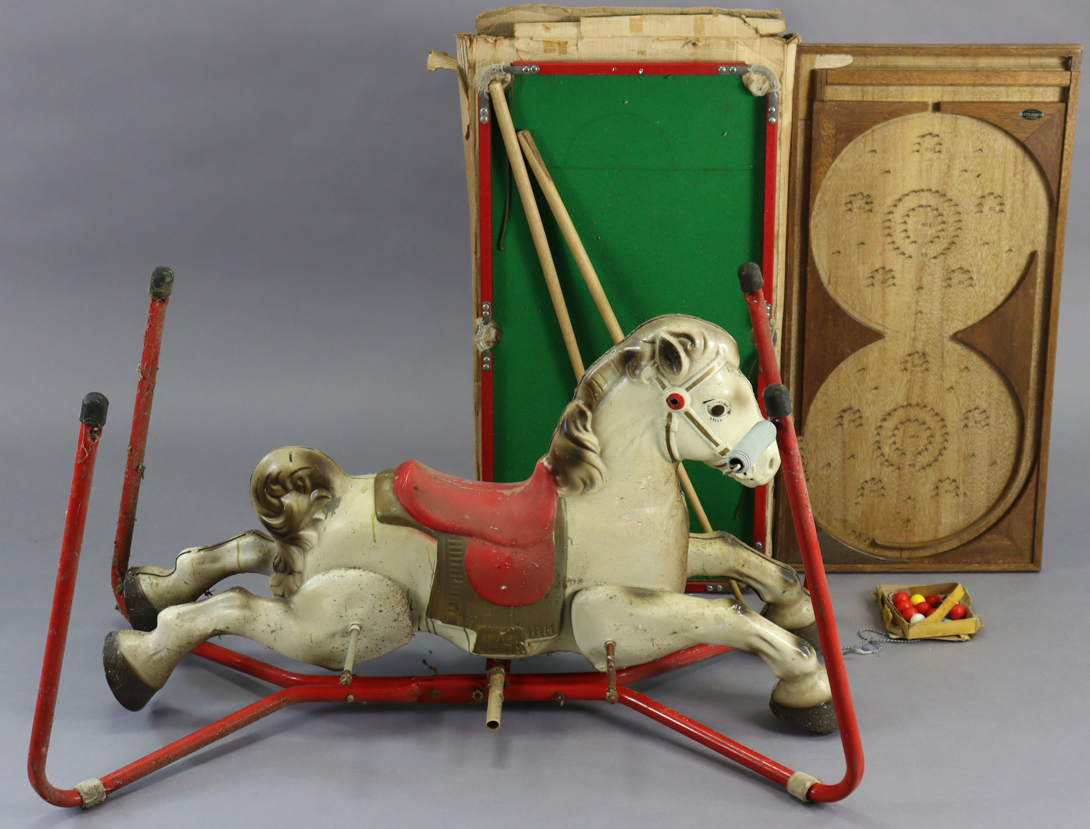 A vintage Mobo “Prairie King” lithographed tin plate rocking horse, 39” wide; together with a Milbro