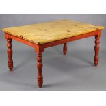 A pine kitchen table with rounded corners to the rectangular top, the stained undertier on four