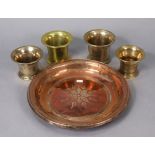 Four brass mortars; & a copper engraved shallow bowl, 14½” diameter.