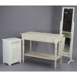 An off white-finish side table fitted with a centre frieze drawer, & on turned legs with an open