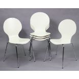 A set of five white-finish stacking chairs each on four silvered-metal legs.