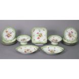 A continental porcelain sixteen-piece dessert service, of white ground & with bright-coloured floral