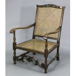 A beech frame easy chair inset woven cane panel to the seat & back, & on turned legs with turned