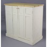 A white painted & natural pine side cabinet fitted two shelves enclosed by a pair of folding panel