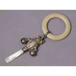 An Edwardian silver novelty owl baby’s rattle with teething ring.