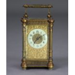 A 19th century brass carriage timepiece, the 1¾” enamel dial with Arabic numerals & on a cast