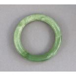 A modern jade bangle, 3¼” diameter, cased.