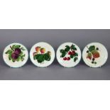 A set of four Wemyss pottery 5½” side plates with green borders on a cream ground, painted with