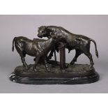 A large bronzed spelter sculpture after P J. Mene, depicting a bull & cow, signed, on oval marble