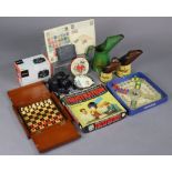 A Peter Pan “Frustration” game, boxed; a travelling chess set; an album of worldwide stamps; &