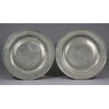 Two 18th century pewter chargers, 18¼” diam., each with engraved initials.