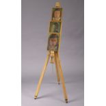 A Daler-Rowney portable artist’s easel; together with three small oil on canvas portrait studies,