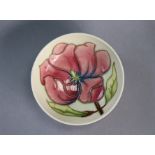 A modern Moorcroft pottery “Hibiscus” pattern small shallow dish, on an ivory ground, 12cm diam. x