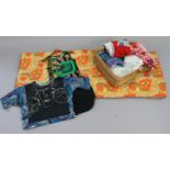 A 1960’s floral decorated sleeping bag; together with various items of vintage clothing; & a