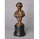 A bronze bust of a lady looking to her right, inscribed “Depon. Gust. Grohe.”, on round socle, 9¼”