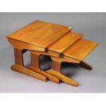 A mid-20th century teak nest of three rectangular low occasional tables, 21” wide x 15¾” wide x 18¾”