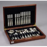 A mahogany canteen containing forty-five items of king’s pattern flatware & cutlery.