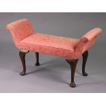 A reproduction window seat with scroll-ends & padded seat upholstered pink materials, & on