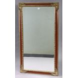 A large gilt frame rectangular wall mirror inset with a bevelled plate, 53” x 29”.