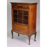 A mahogany display cabinet fitted frieze drawer above two shelves enclosed by a glazed door, & on