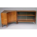 A 1960’s teak ‘Greens & Thomas’ sideboard fitted with an adjustable centre shelf, enclosed by