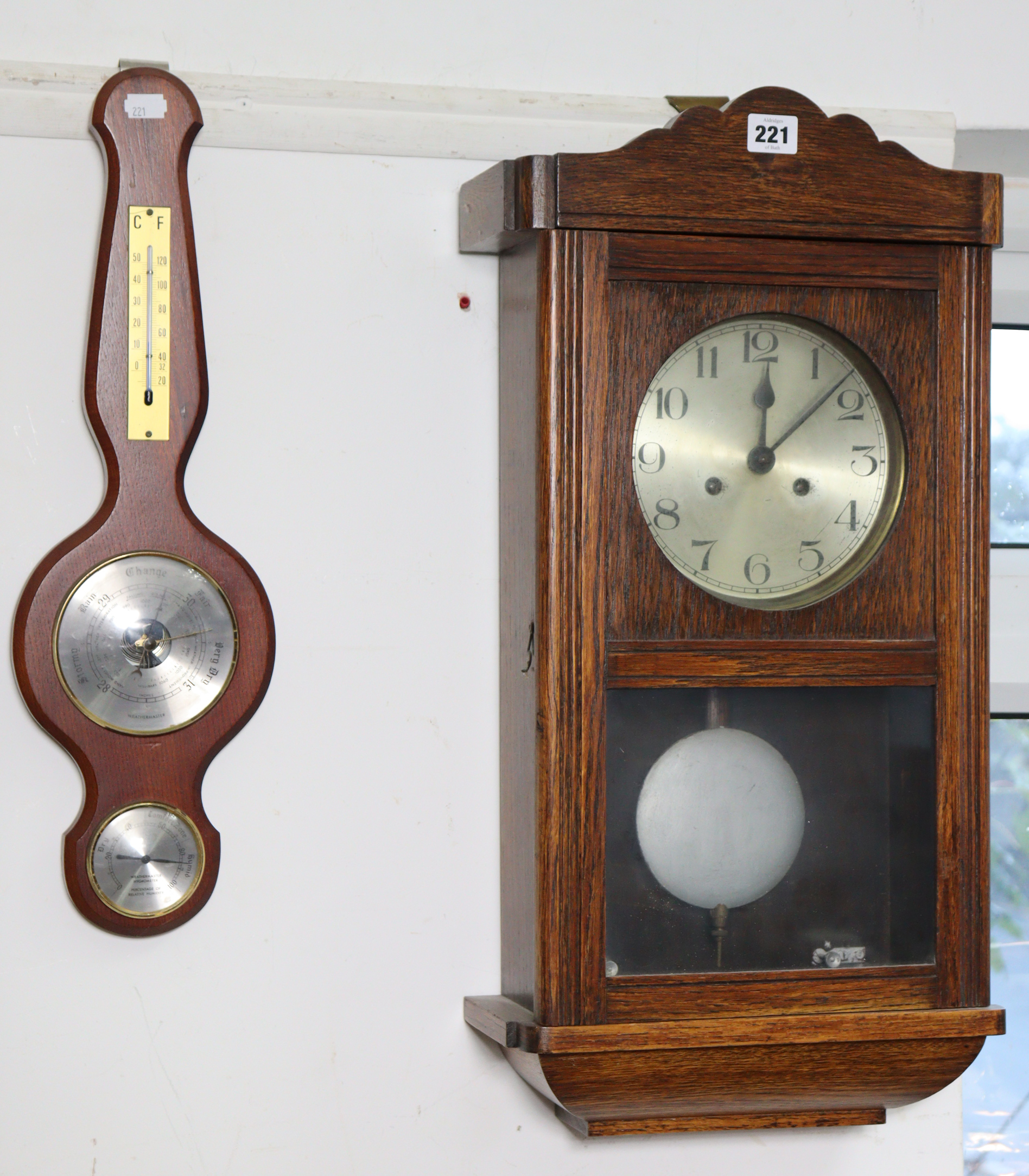 A mid-20th century wall clock with a striking movement, and in an oak case, 25” high, together - Image 2 of 4
