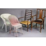 An Edwardian rail-back elbow chair with a padded seat, & on round tapered legs with turned
