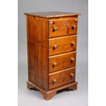 A pine upright chest fitted four long drawers with turned knob handles, & on bracket feet, 23¼” wide