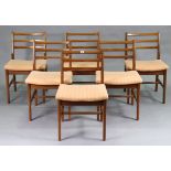 A set of six mid-20th century teak dining chairs with ladder backs & square padded seats, stamped “A