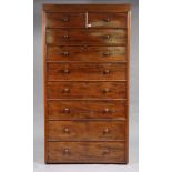 A Victorian mahogany tall chest fitted two short & seven long graduated drawers with turned knob