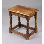 A reproduction oak joint-stool on baluster-turned legs with plain stretchers 17¾” wide x 17½” high.