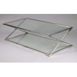 A mid/late 20th century glass-top coffee table on chrome frame with x-shaped end supports, 55¼” wide