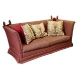 A Knole-style three-seater drop-end settee upholstered crimson material 84” long x 39" high x 38" de