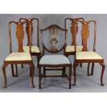 A set of four Queen-Anne style mahogany splat-back dining chairs each with a padded drop-in-