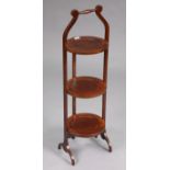 An Edwardian inlaid mahogany three-tier folding cake stand on shaped supports, 34¼” high, & an oak