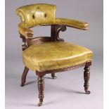 A Victorian mahogany elbow chair upholstered buttoned & brass studded green leather , on turned