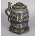 A Chinese bronze & champleve enamel two-handled vase & cover, of barrel form with archaistic