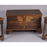 An 18th century oak small coffer or mule chest with moulded edge to the rectangular lift-top, fitted