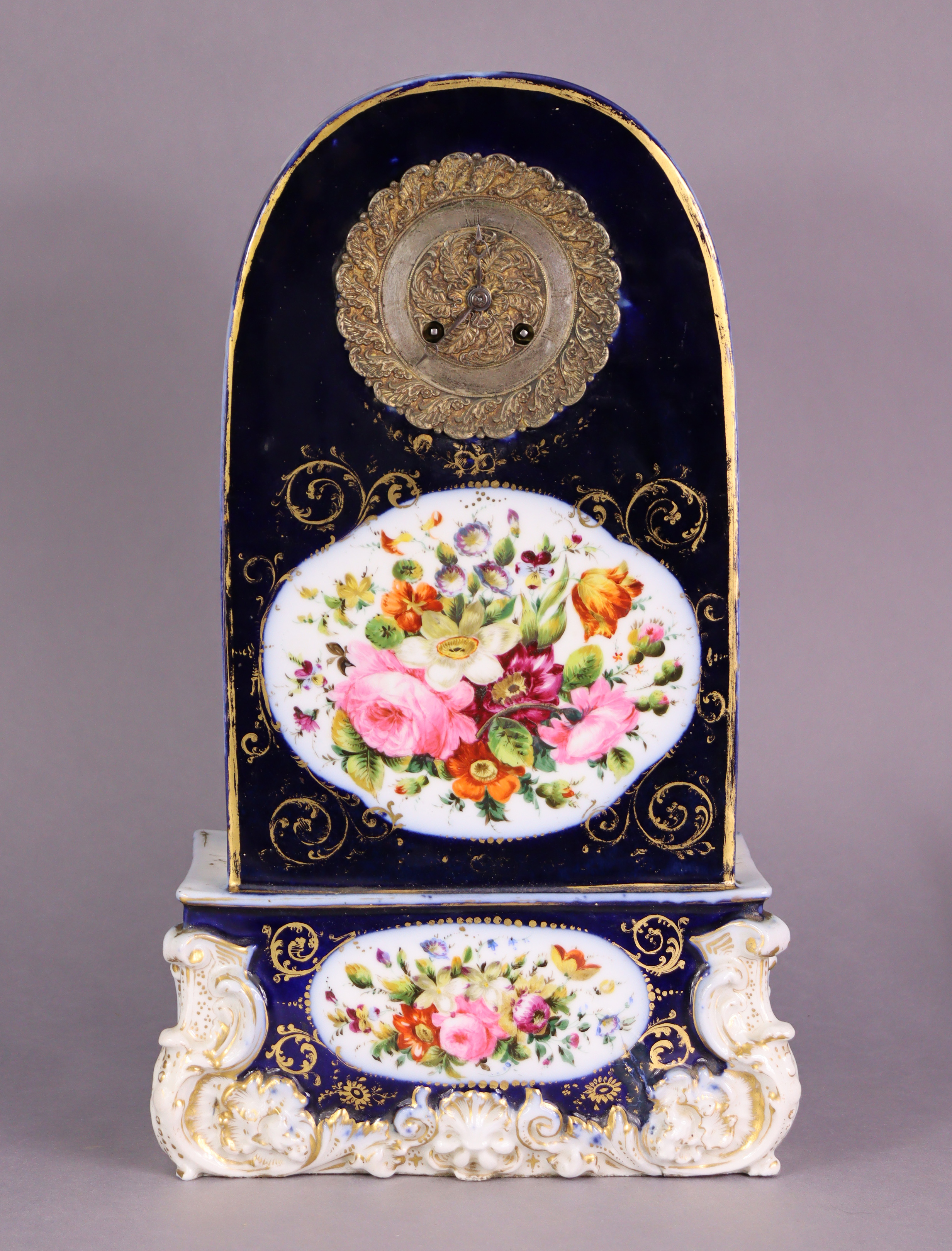 A mid-19th century French porcelain mantel clock with 4½” dia. gilt-metal & silvered dial, silk