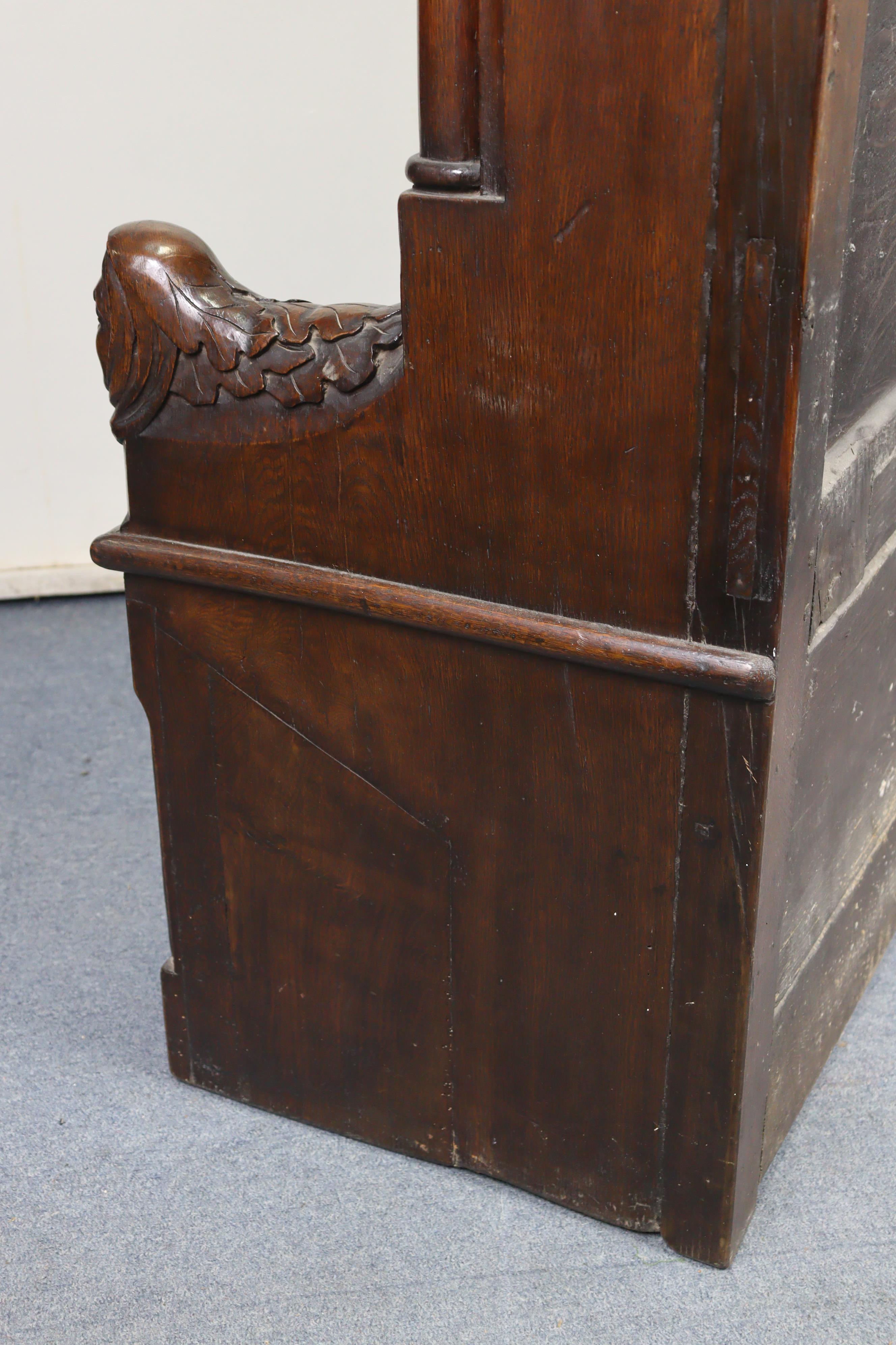 A late Victorian oak box-seat settle in the Gothic manner, the castellated panelled back flanked - Image 11 of 11